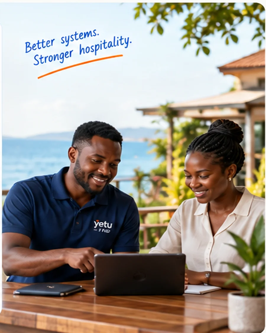 FBC engineer and a hotelier sitting together at a sunny resort table, focused on a laptop during an onboarding walkthrough