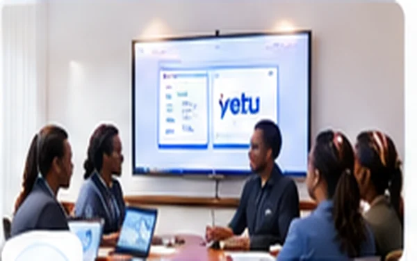 Hotel team gathered around a screen showing the Yetu interface during a training workshop